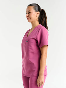 side view of red violet one pocket v neck scrub top