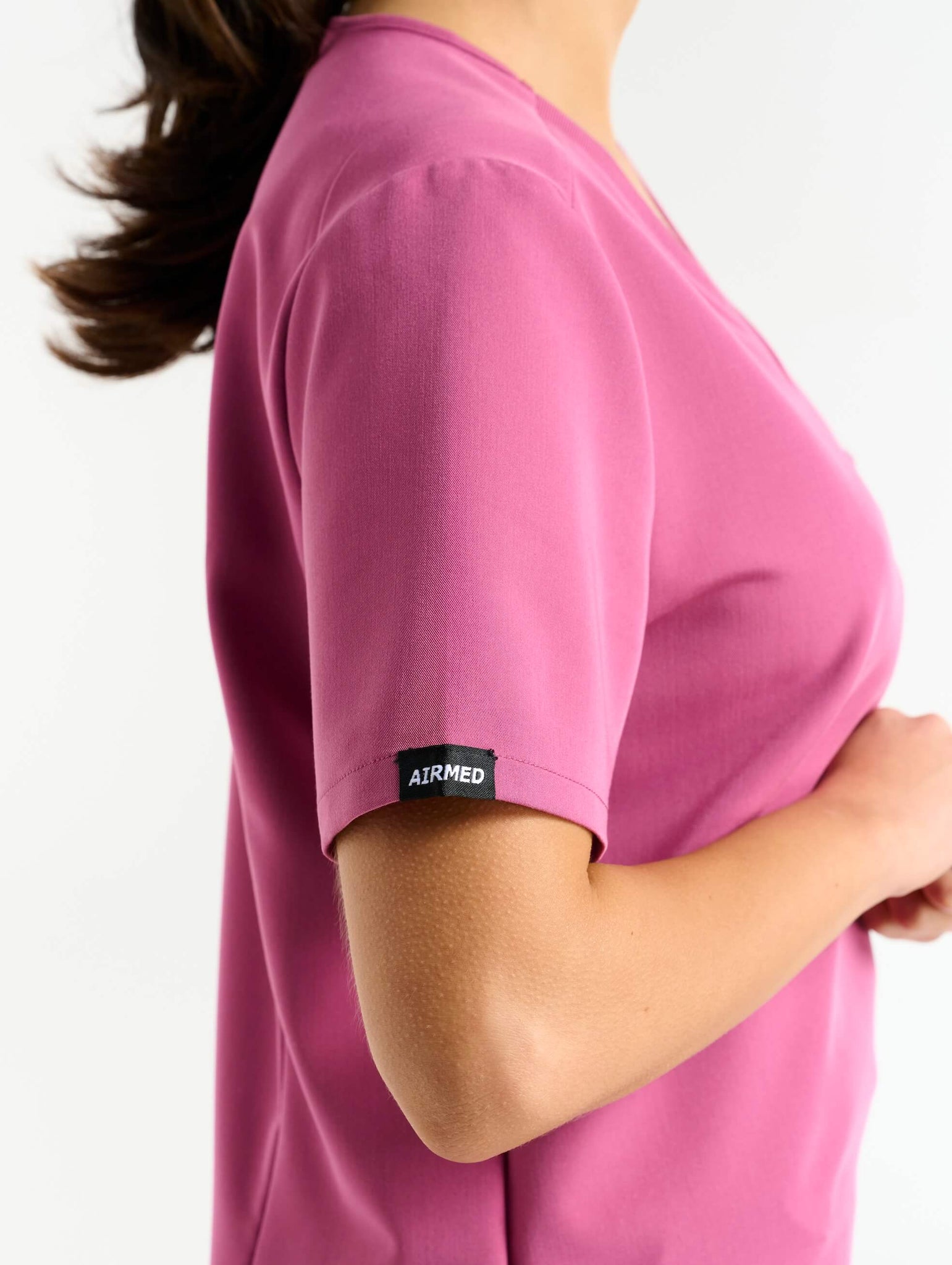 close up of pocket detail of red violet one pocket v neck scrub top
