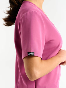 close up of pocket detail of red violet one pocket v neck scrub top
