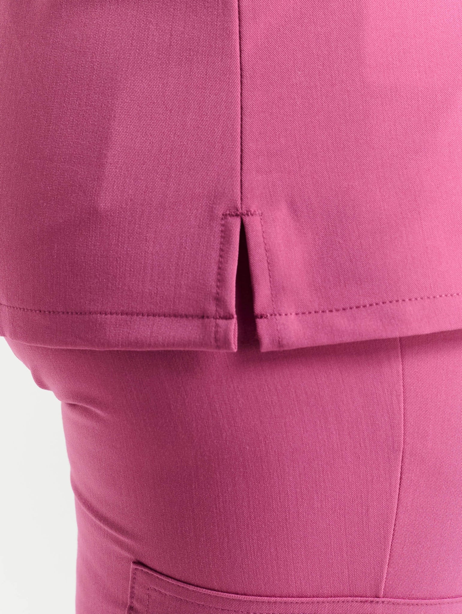 close up of neckline detail of red violet one pocket v neck scrub top