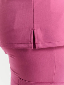 close up of neckline detail of red violet one pocket v neck scrub top