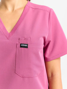close up of sleeve detail of red violet one pocket v neck scrub top