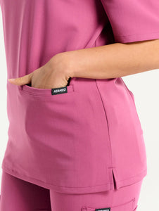 close up of hem detail of red violet v neck scrub top